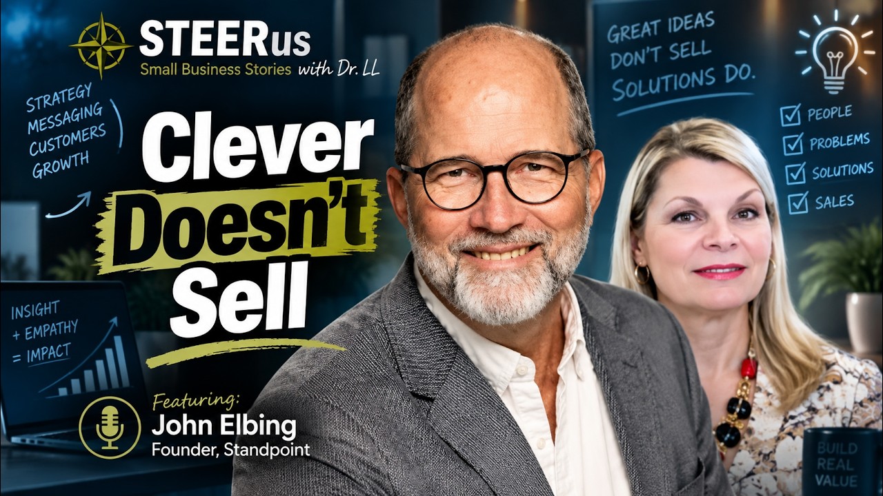 The episode thumbnail: John Elbing in glasses and a grey jacket in the foreground, host Loralyn Mears behind him on the right, the title Clever Doesn't Sell in large letters, and a whiteboard reading Great ideas don't sell, solutions do